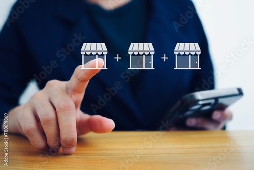 Business woman pointing at online shopping store icon ecommerce business website Shopping with a credit card Digital payment system.