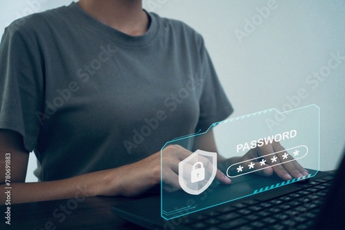 Cybersecurity and data access networks Businessman using computer with virtual cyber security icon to access personal security information.
