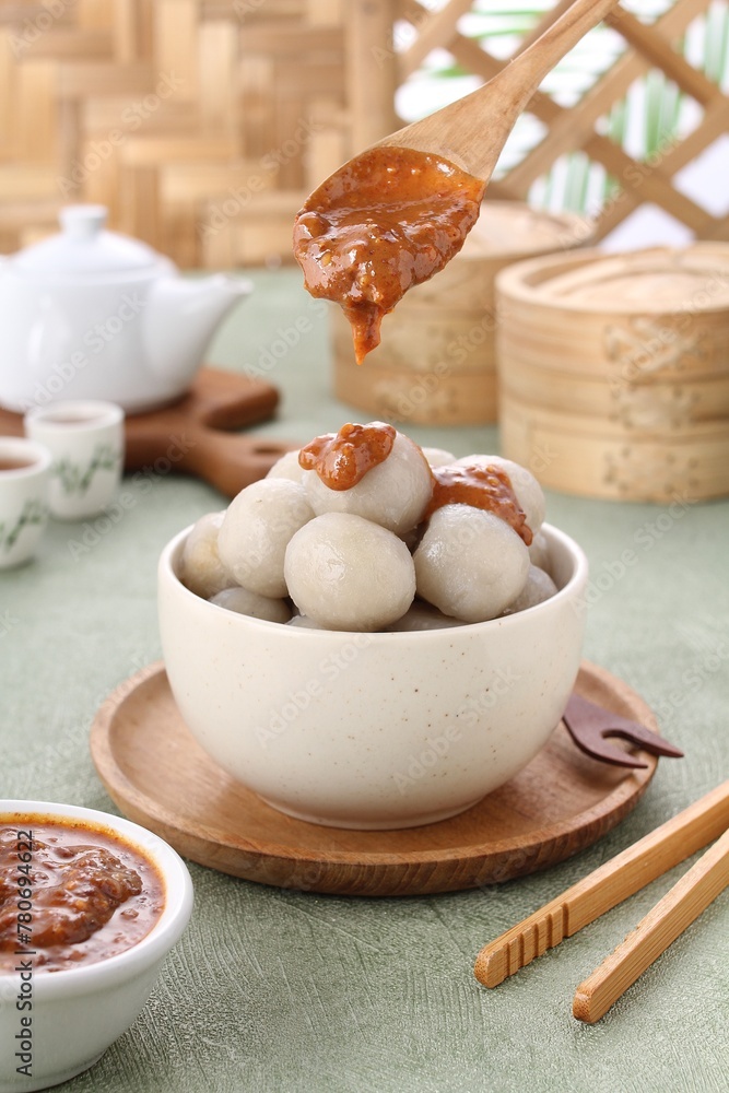 Cilok is a snack made from tapioca flour and served with savory and spicy peanut sauce Cilok is a snack made from tapioca flour and served with savory and spicy peanut sauce