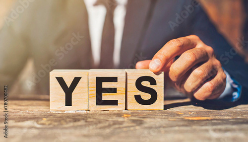 Wooden blocks with word YES photo