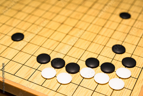 囲碁 は 中国発祥 とされる ボードゲーム 【 囲碁 の 対局 の イメージ 】 photo