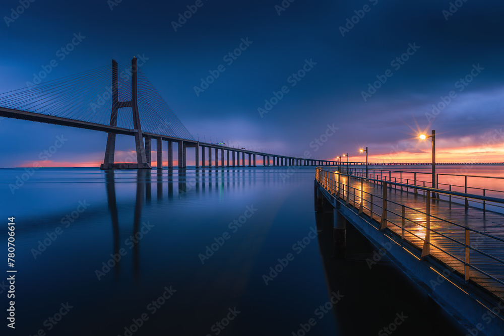 Beautiful sunrise at Vasco Da Gama Bridge in Lisbon, Portugal.