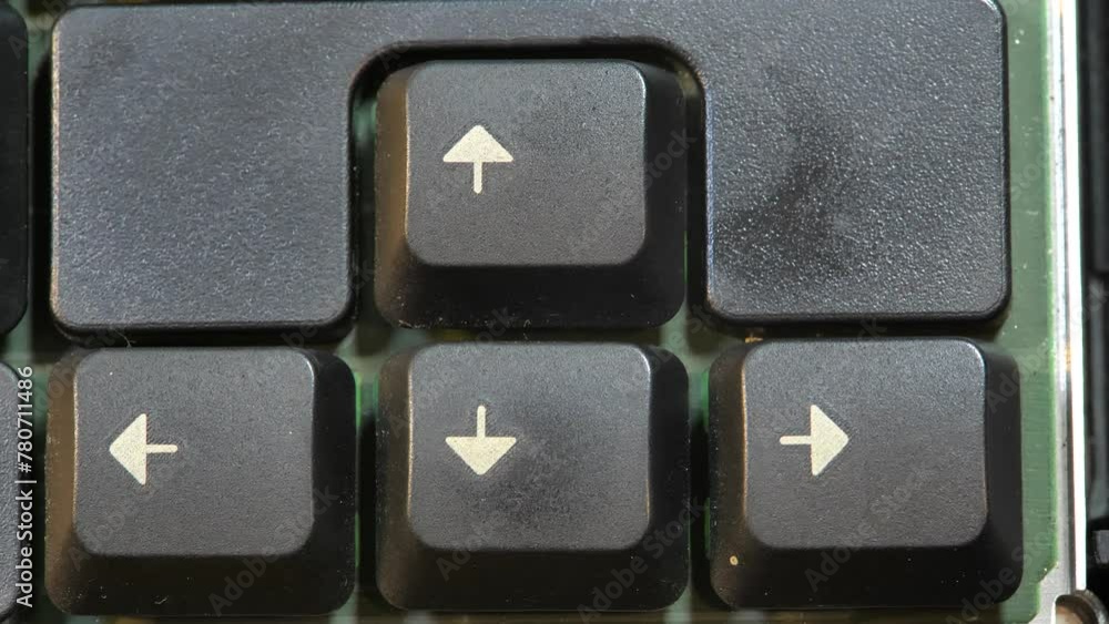 Simple arrow keys small 4 directional arrow key buttons on a laptop computer keyboard, top down table top view, from above, nobody. Different directions, navigation, routes simple abstract concept Simple arrow keys small 4 directional arrow key buttons on a laptop computer keyboard, top down table top view, from above, nobody. Different directions, navigation, routes simple abstract concept