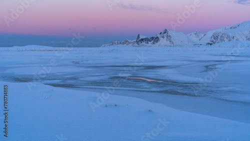 gefrorener Fjord bei Sandbotnen, rosafarbener Himmel in der Abenddämmerung, Schnee und Eis im Winter auf den Lofoten photo