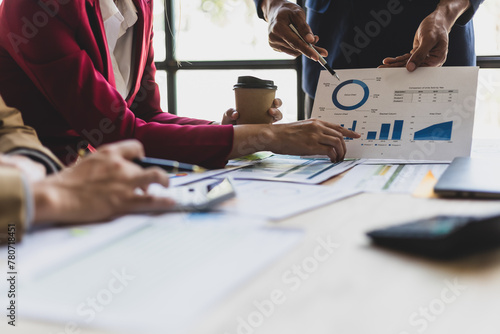 Business meeting, Financial consultants discuss investment growth chart analysis in company financial reports and are planning marketing business strategies.