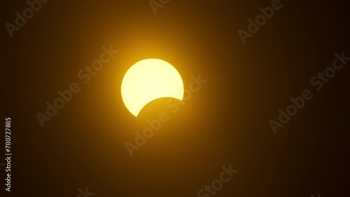 Beginning of partial solar eclipse time lapse closeup photo