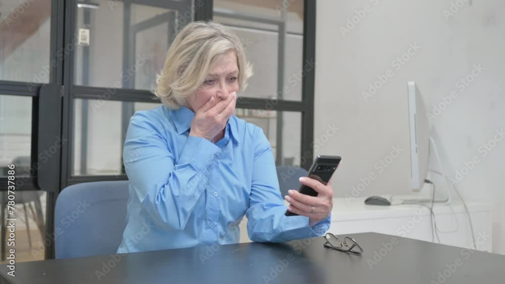 Senior Old Woman Shocked by Online Trading Loss on Phone in Office Senior Old Woman Shocked by Online Trading Loss on Phone in Office