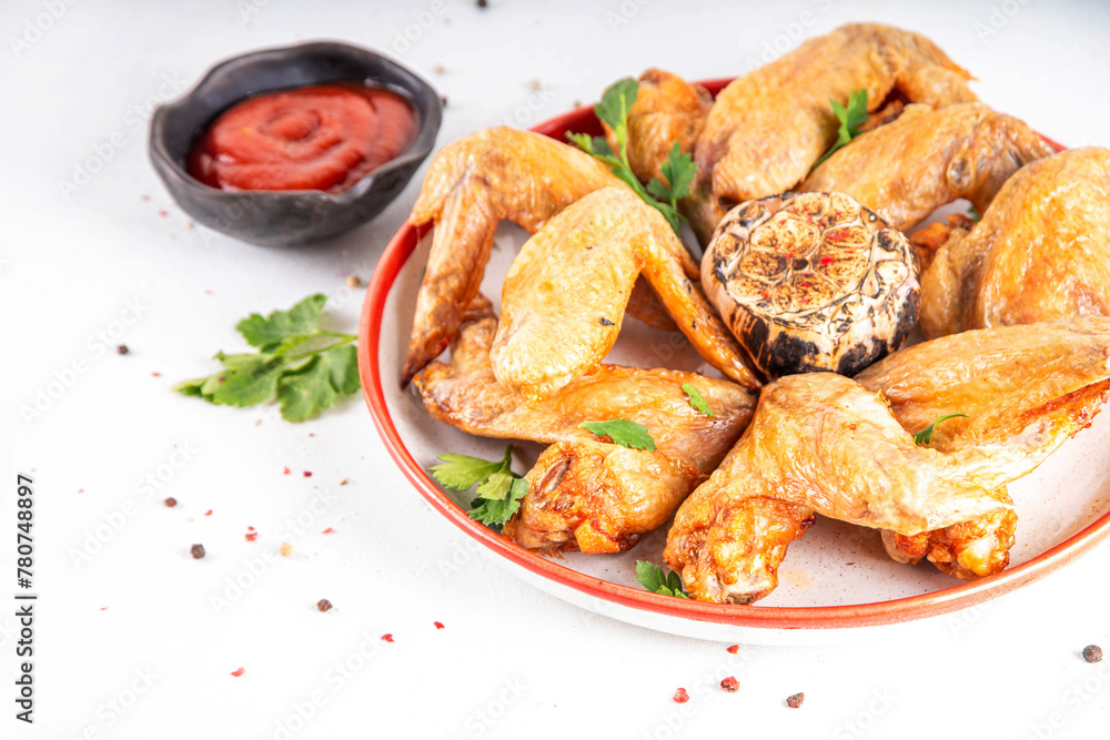Grilled roasted spicy chicken wings with ketchup Grilled roasted spicy chicken wings with ketchup