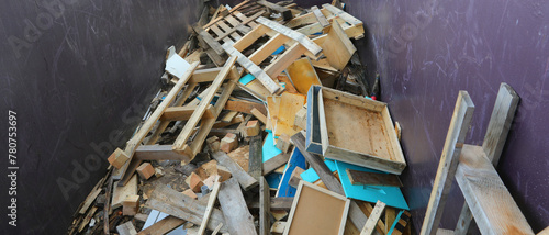Inside a recycling center container with wooden pieces and scrap lumber photo