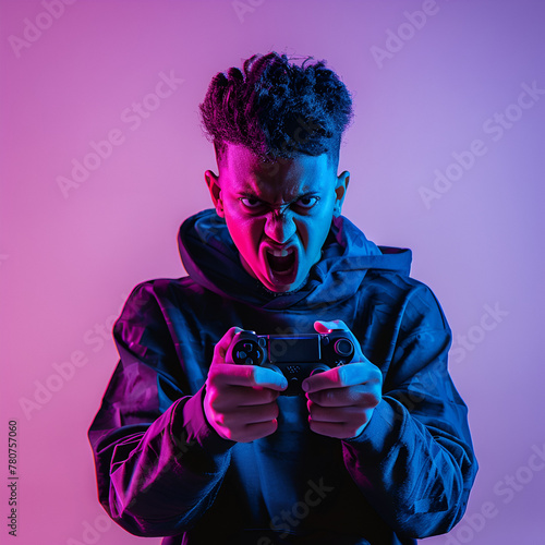 A person standing with an angry expression on his face, holding a controller in his hand © AlazySM