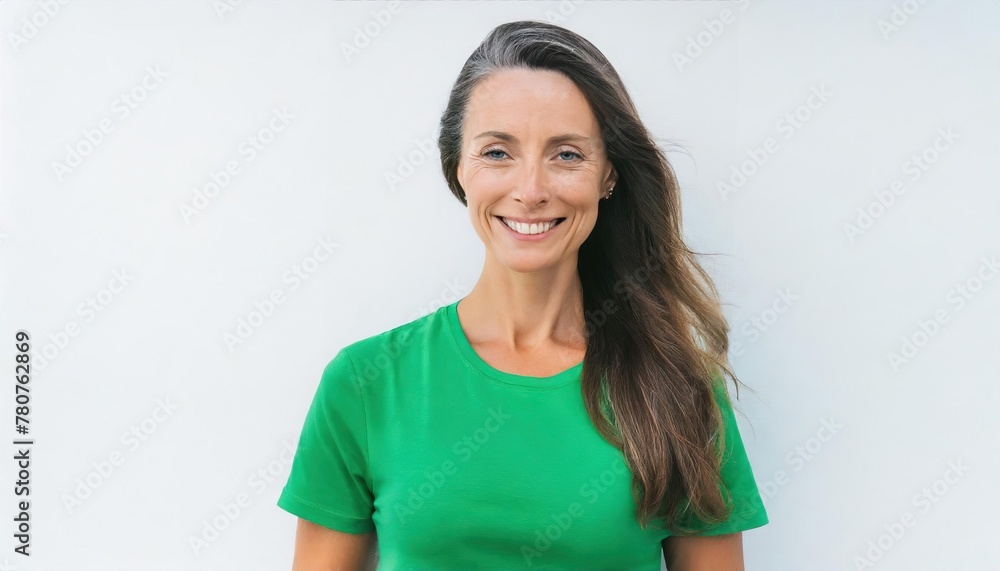 Portrait of happy mature woman in bright vivid green dress smiling to the camera isolated on white background with copy space Portrait of happy mature woman in bright vivid green dress smiling to the camera isolated on white background with copy space