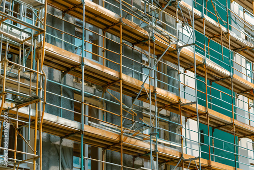 construction scaffold and scaffolding at the construction of new building,solarization effect , Building under construction © YOUCEF