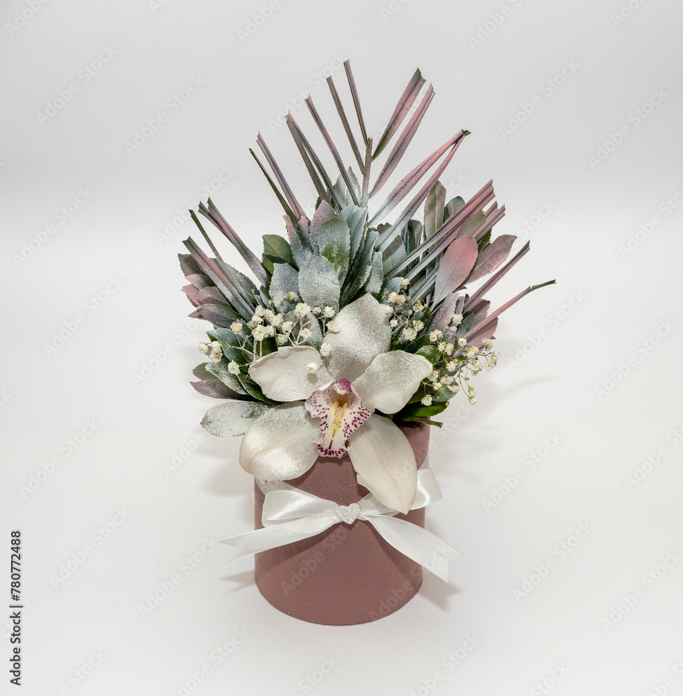 Obraz premium Orchid flower arrangement in a brown pot on an off-white background. Orchid, orchid flower, 