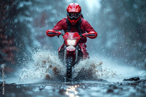 Motorcycle rider in red speeds through water, creating a dramatic splash with focused and determined look