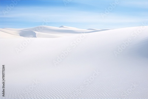 White sand dunes under a clear blue sky in the desert, creating a beautiful and serene landscape in the heart of nature