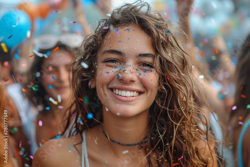 Joyous young woman covered in confetti enjoys a festival  her happiness and carefree attitude shine through