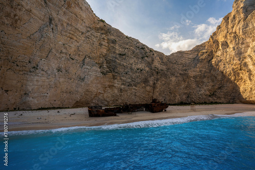 Panoramic view of the famous Navagio shipwreck beach on Zakynthos island, Greece, with people enjoying the light blue colored sea