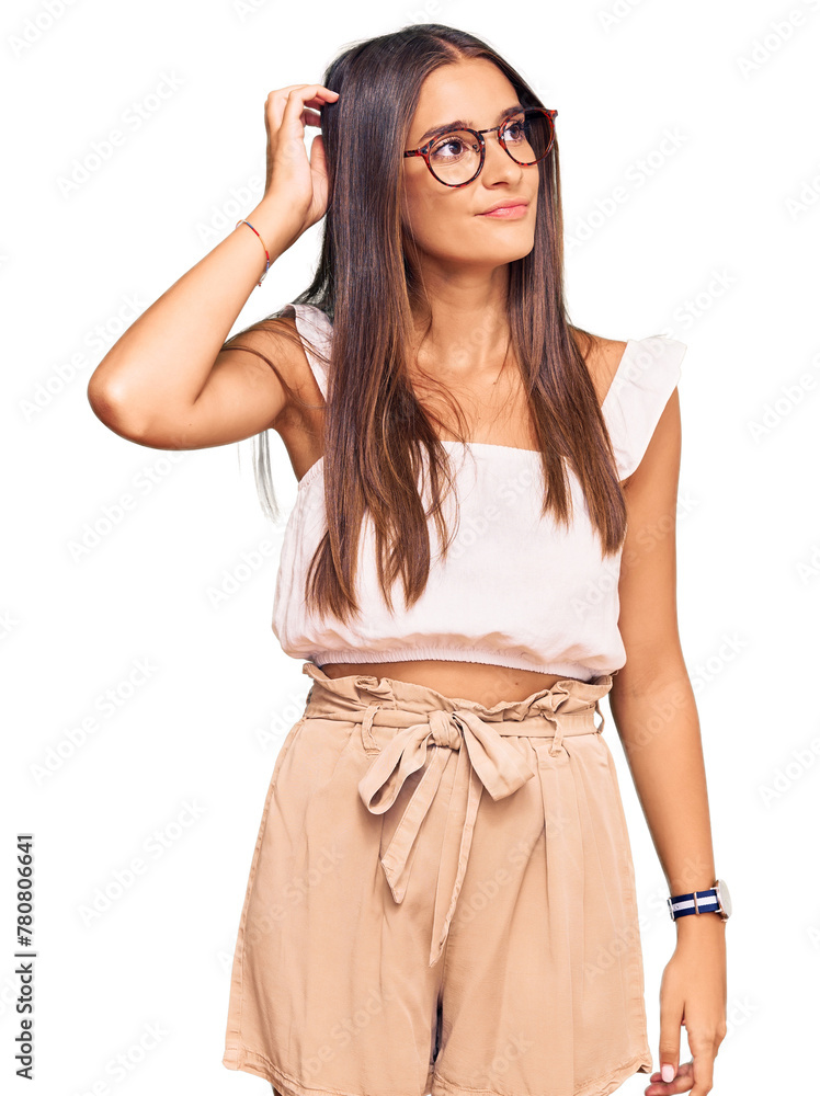 Young hispanic woman wearing casual clothes and glasses confuse and wondering about question. uncertain with doubt, thinking with hand on head. pensive concept. Young hispanic woman wearing casual clothes and glasses confuse and wondering about question. uncertain with doubt, thinking with hand on head. pensive concept.