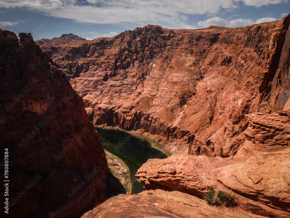Wide view looking down on Colorado River in Glen Canyon in red sandstone canyon in Page Arizona
