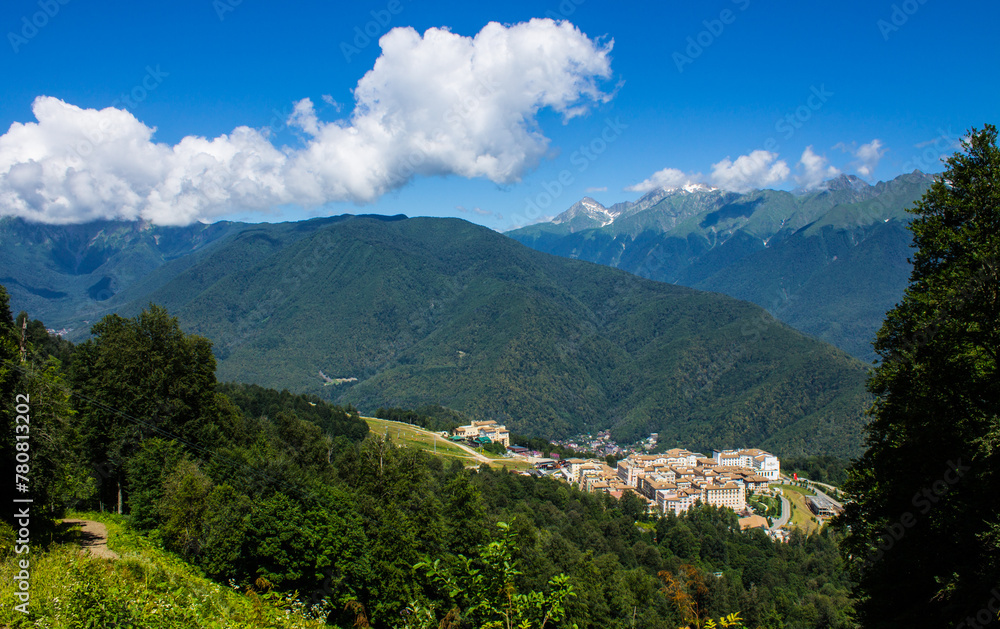 Beautiful panoramic landscape - view of Glade 960 with modern luxury hotels among the green mountains on a sunny summer day in Russia Beautiful panoramic landscape - view of Glade 960 with modern luxury hotels among the green mountains on a sunny summer day in Russia