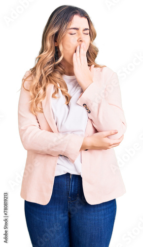 Young caucasian woman wearing business clothes bored yawning tired covering mouth with hand. restless and sleepiness.
