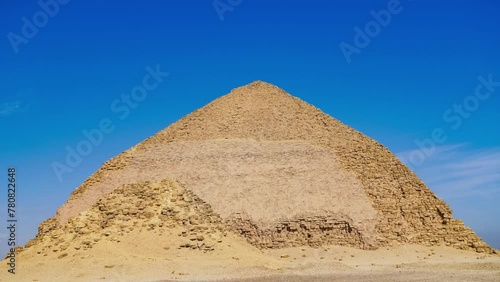 The Bent Pyramid is an ancient Egyptian pyramid located at the royal necropolis of Dahshur, approximately 40 kilometres south of Cairo, built under the Old Kingdom Pharaoh Sneferu. Egypt photo