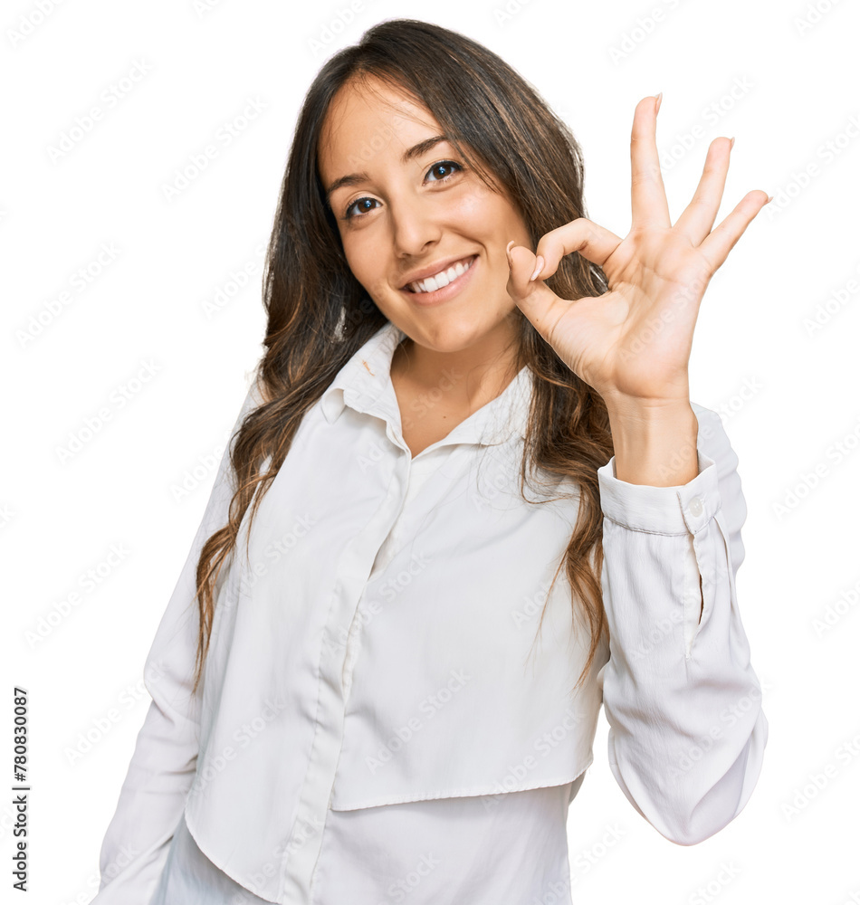 Young brunette woman wearing casual clothes smiling positive doing ok sign with hand and fingers. successful expression. Young brunette woman wearing casual clothes smiling positive doing ok sign with hand and fingers. successful expression.