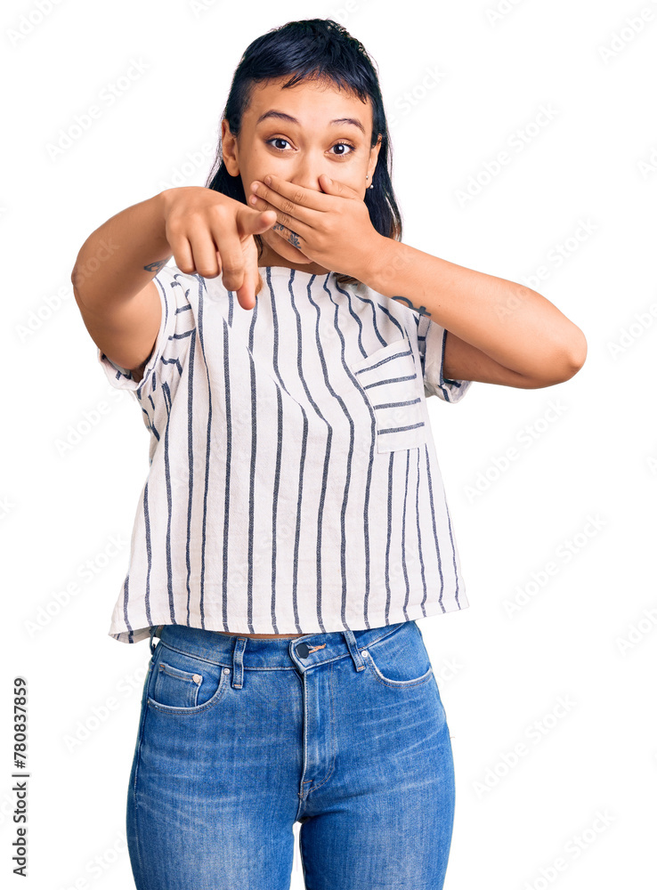 Young woman wearing casual clothes laughing at you, pointing finger to the camera with hand over mouth, shame expression Young woman wearing casual clothes laughing at you, pointing finger to the camera with hand over mouth, shame expression