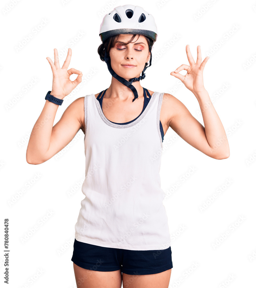 Beautiful young woman with short hair wearing bike helmet relax and smiling with eyes closed doing meditation gesture with fingers. yoga concept. Beautiful young woman with short hair wearing bike helmet relax and smiling with eyes closed doing meditation gesture with fingers. yoga concept.