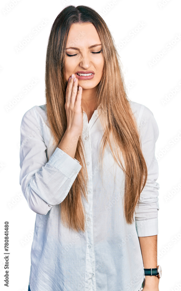 Beautiful caucasian woman wearing casual white shirt touching mouth with hand with painful expression because of toothache or dental illness on teeth. dentist Beautiful caucasian woman wearing casual white shirt touching mouth with hand with painful expression because of toothache or dental illness on teeth. dentist