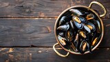Boiled mussels in copper cooking dish on dark wooden background 
