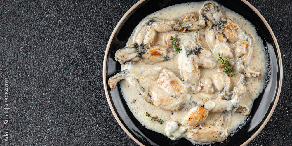frog legs food French cuisine second course shriveled Cooking appetizer meal food snack on the table copy space food background frog legs food French cuisine second course shriveled Cooking appetizer meal food snack on the table copy space food background