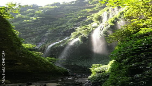 Aerial vertical footage Madakaripura waterfall during a morning in East Java, Indonesia