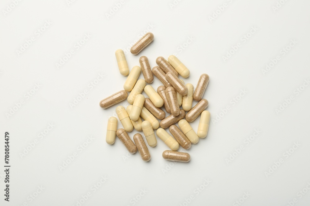 Different vitamin capsules on white background, top view Different vitamin capsules on white background, top view
