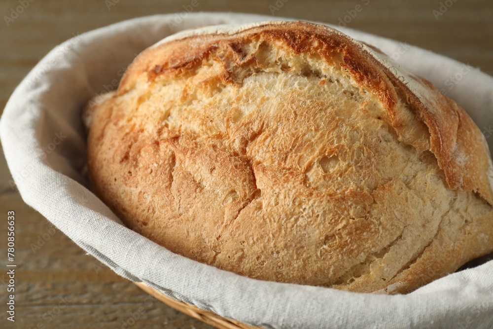 Basket with fresh bread on table, closeup Basket with fresh bread on table, closeup