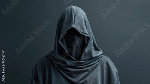 A person in a hoodie standing in front of a dark background. Suitable for mystery or urban themes