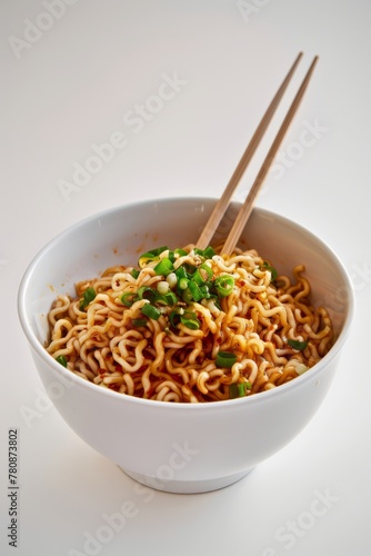 Dynamic Masala Instant noodles with a chopstick in it in fresh white coloures modern bowl, fine dyning photography few fresh exotic veggies, generated with AI photo