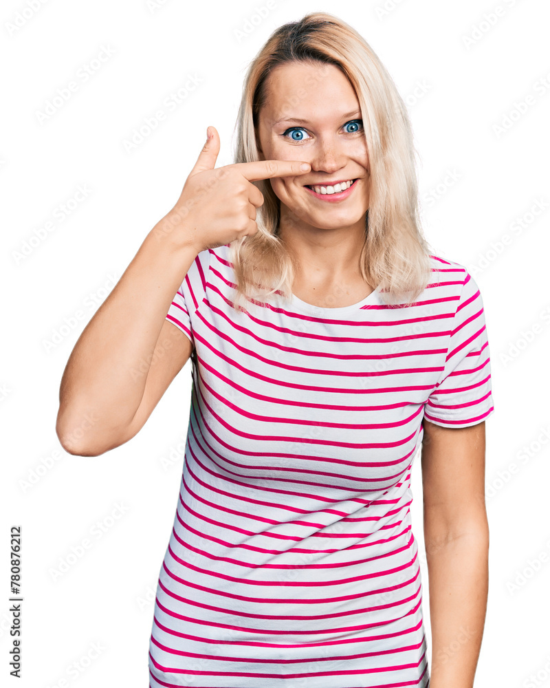 Young caucasian woman wearing casual clothes pointing with hand finger to face and nose, smiling cheerful. beauty concept Young caucasian woman wearing casual clothes pointing with hand finger to face and nose, smiling cheerful. beauty concept