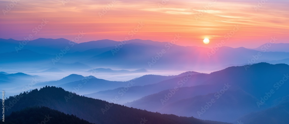 Sunrise over mountains with rays piercing through mist and trees. Warm, tranquil landscape.
