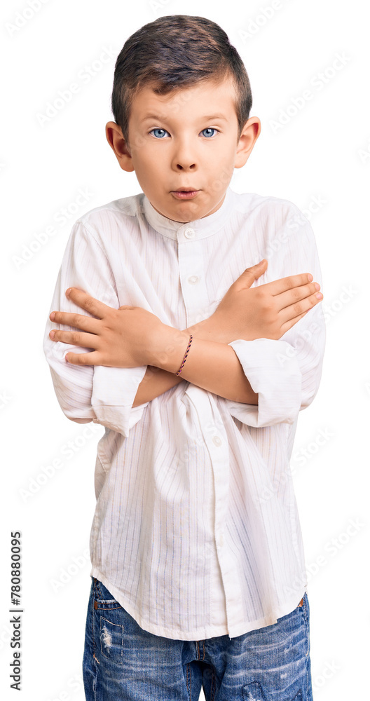 Cute blond kid wearing elegant shirt shaking and freezing for winter cold with sad and shock expression on face Cute blond kid wearing elegant shirt shaking and freezing for winter cold with sad and shock expression on face