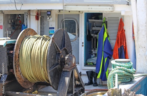 The back of an old fishing boat with a winch