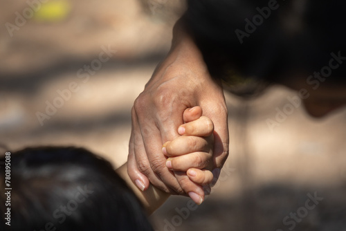 Family members holding hands together in union photo