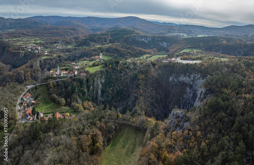 Škocjan village and sinkhole Velika and Mal dolina bellow in Škocjan caves park in Karst region, Slovenia