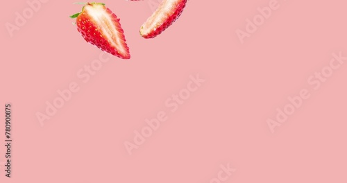 Animation of strawberries falling on a pink background (ID: 780900875)