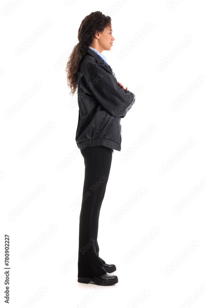 African-American female police officer with crossed arms on white background African-American female police officer with crossed arms on white background