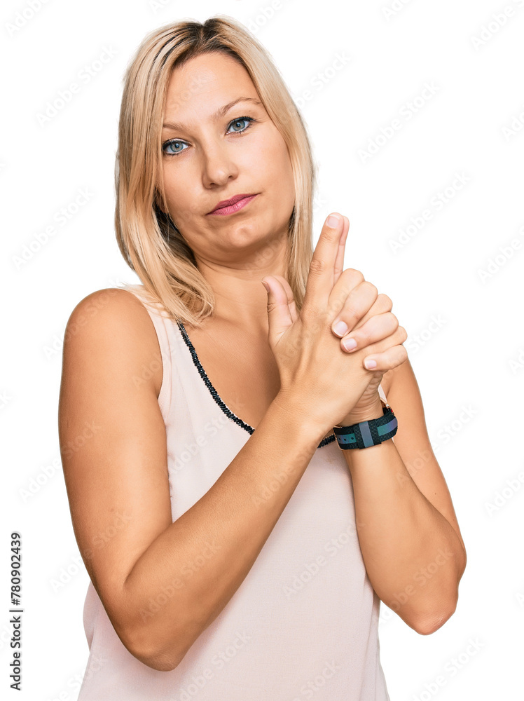Middle age caucasian woman wearing casual clothes holding symbolic gun with hand gesture, playing killing shooting weapons, angry face Middle age caucasian woman wearing casual clothes holding symbolic gun with hand gesture, playing killing shooting weapons, angry face