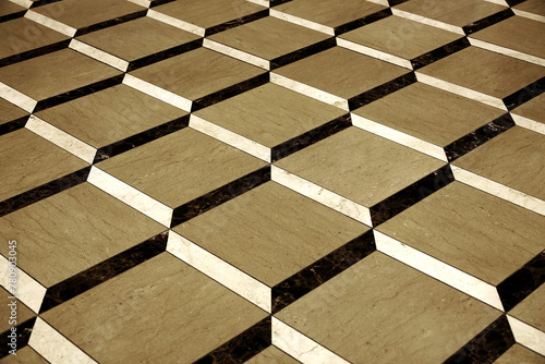 Background material showing a close-up of a three-dimensional floor designed with three types of tiles