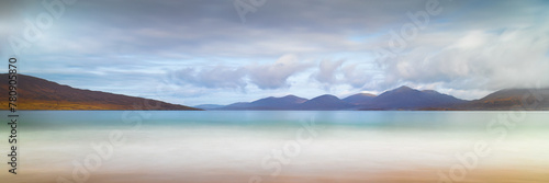 Luskentyre Beach Panoramic with clouds in he sky and a golden beach