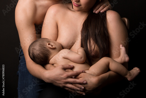 Mother breast feeding baby naturally