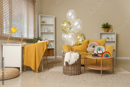 Basket with balloons and to...